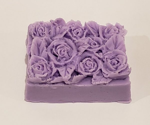 rectangular bar of soap with rose and leaf design on top