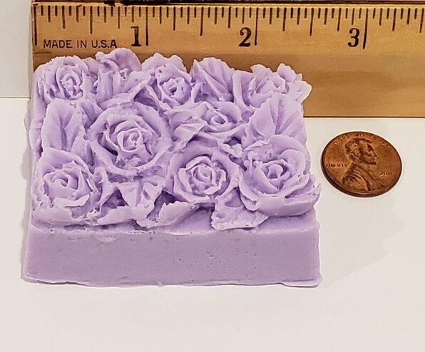 rose top soap with ruler to show length
