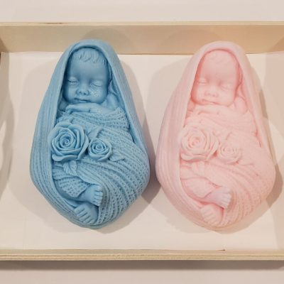 soap shaped like babies in blue and pink