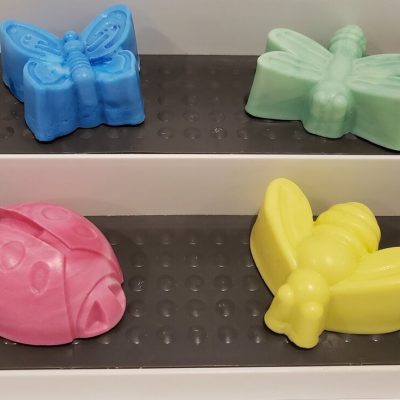 soaps shaped like a bee, ladybug, dragonfly and butterfly