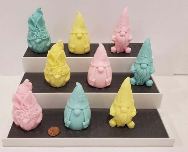 soaps shaped like gnomes in yellow, pink and mint
