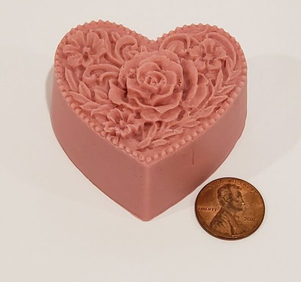 heart shaped soap with a penny for scale