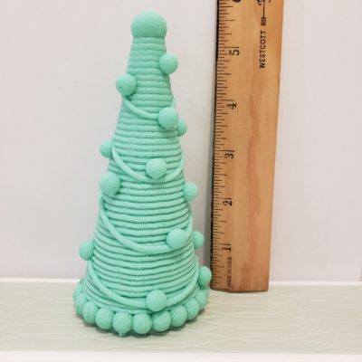 Tall-Christmas-tree-of-soap-next-to-ruler