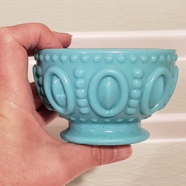 pottery-soap-empty-held-between-finger